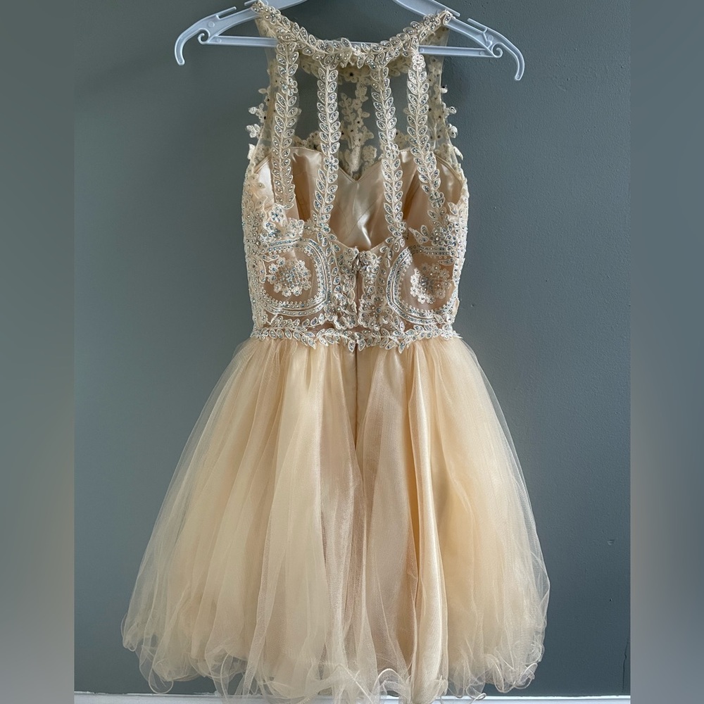 This is a Fiesta Fashion Dress. Size XS, color yellow